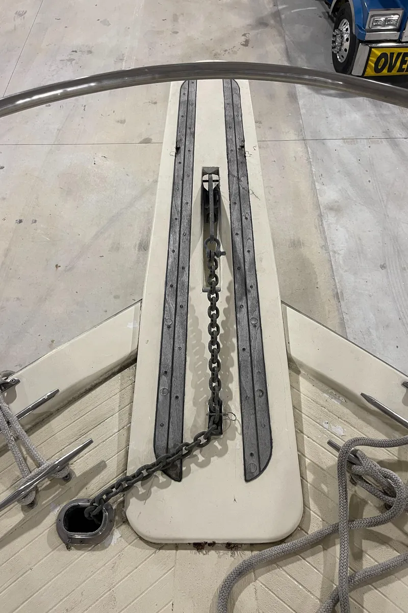 Slide: The Image of 1979 Viking 43 Double Cabin boat deck with anchor chain and ropes. - 16