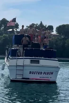 Slide: The Image of 1979 Viking 43 Double Cabin boat named "Busted Flush" with people on deck, Milwaukee, WI. - 3