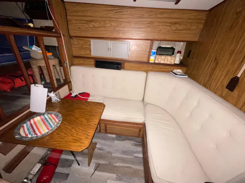 Slide: The Image of Interior of 1979 Viking 43 Double Cabin with cozy seating and wooden accents. - 8