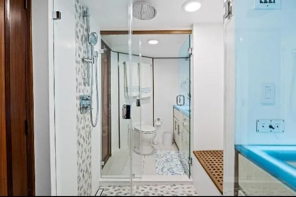 Slide: The Image of Luxurious bathroom on 1989 Hatteras 70 Motor Yacht with modern shower and elegant design. - 18