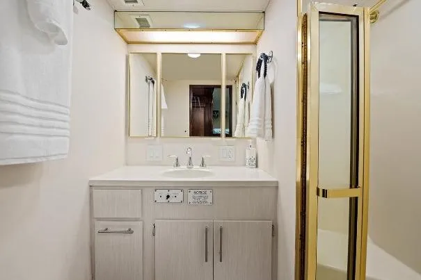 Slide: The Image of Bathroom interior of 1989 Hatteras 70 Motor Yacht with vanity and shower. - 25
