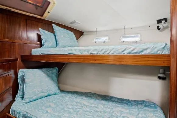 Slide: The Image of Bunk beds in 1989 Hatteras 70 Motor Yacht cabin with blue bedding. - 26