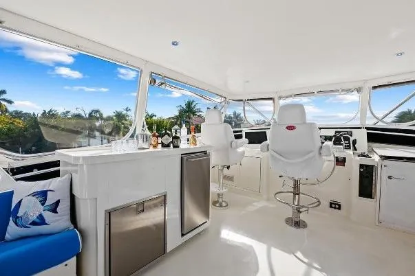 Slide: The Image of Luxurious interior of 1989 Hatteras 70 Motor Yacht with bar and captain's chairs. - 30