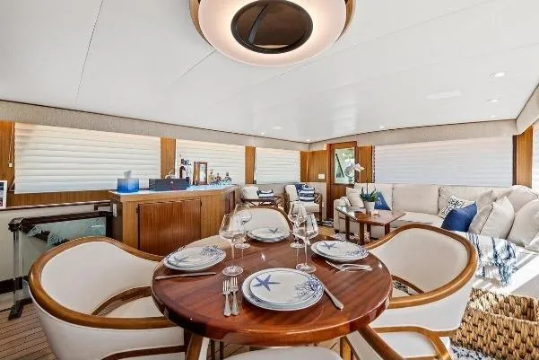 Slide: The Image of Luxurious interior of 1989 Hatteras 70 Motor Yacht with elegant dining area. - 6