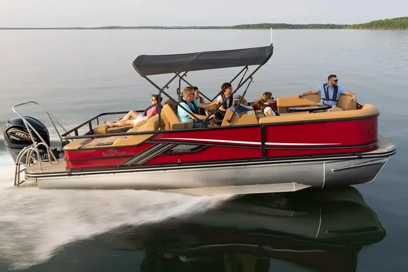 Slide: The Image of Manufacturer Provided Image: 2026 SunCatcher Fusion 324SS pontoon boat cruising on a calm lake with passengers. - 2