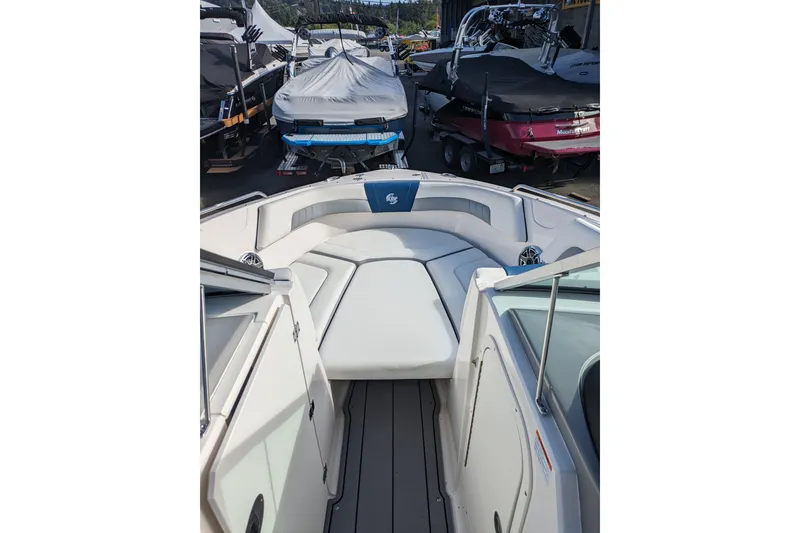 Slide: The Image of 2023 Chaparral 23 Surf boat interior with spacious seating and modern design. - 9