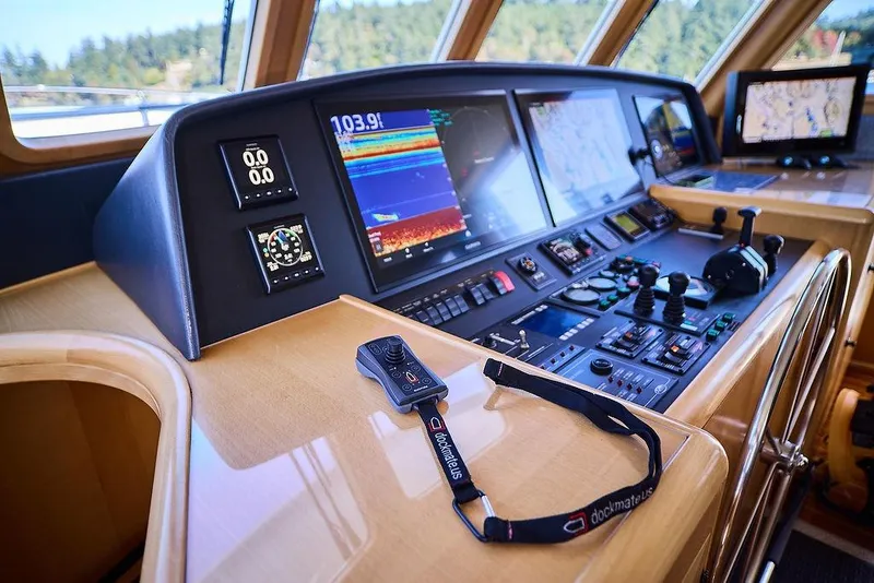 Slide: The Image of Control panel of a 2000 Northern Marine 75 yacht, featuring advanced navigation equipment. - 10