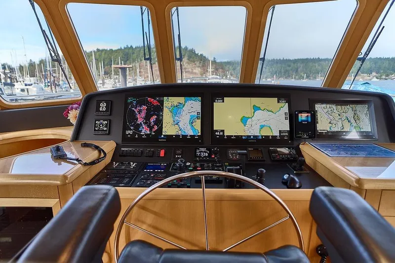 Slide: The Image of Pilothouse of 2000 Northern Marine 75 yacht with navigation screens and steering wheel. - 15