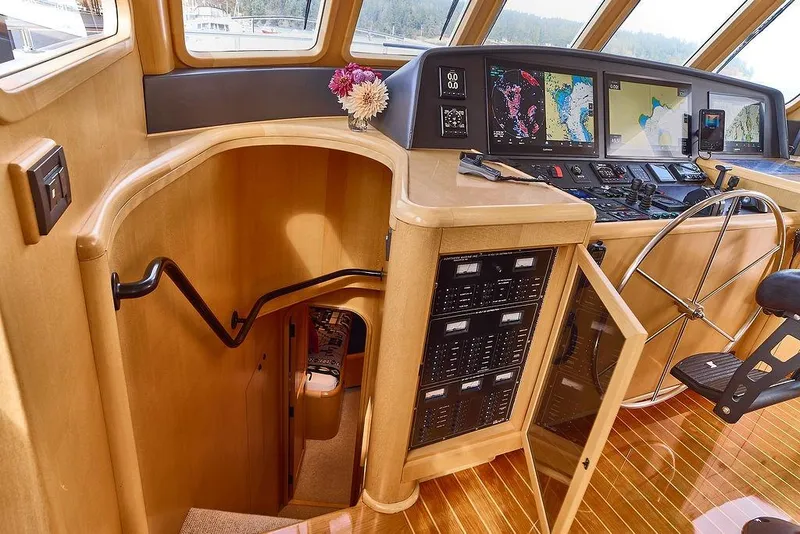 Slide: The Image of Pilothouse of 2000 Northern Marine 75 yacht with navigation equipment and wooden interior. - 16