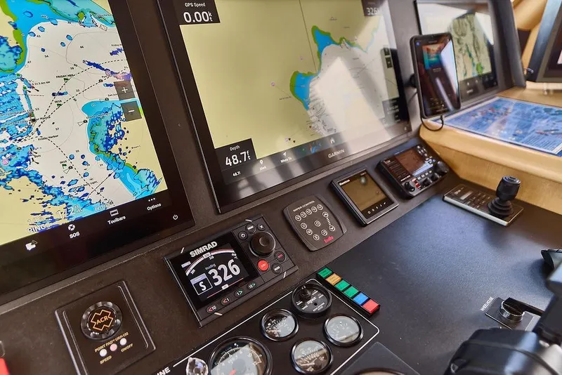 Slide: The Image of Navigation equipment on Northern Marine 75 yacht, 2000 model, featuring digital displays and controls. - 19