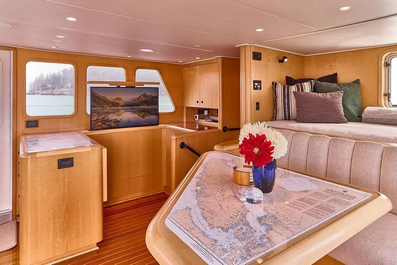 Slide: The Image of Luxurious interior of 2000 Northern Marine 75 yacht with elegant wood finish and cozy seating. - 22