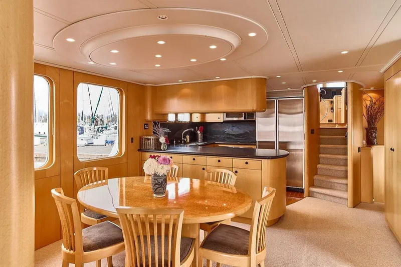 Slide: The Image of Luxurious interior of 2000 Northern Marine 75 yacht with elegant dining area and modern kitchen. - 27