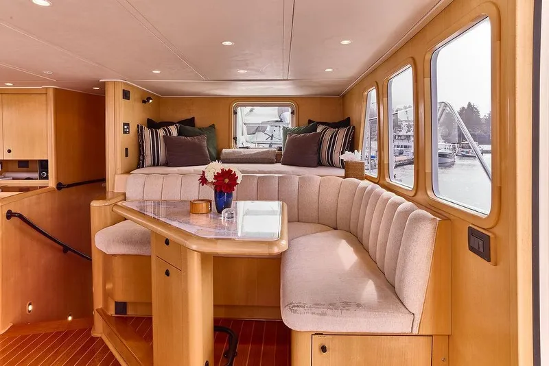 Slide: The Image of Luxurious interior of 2000 Northern Marine 75 yacht with elegant seating and large windows. - 30