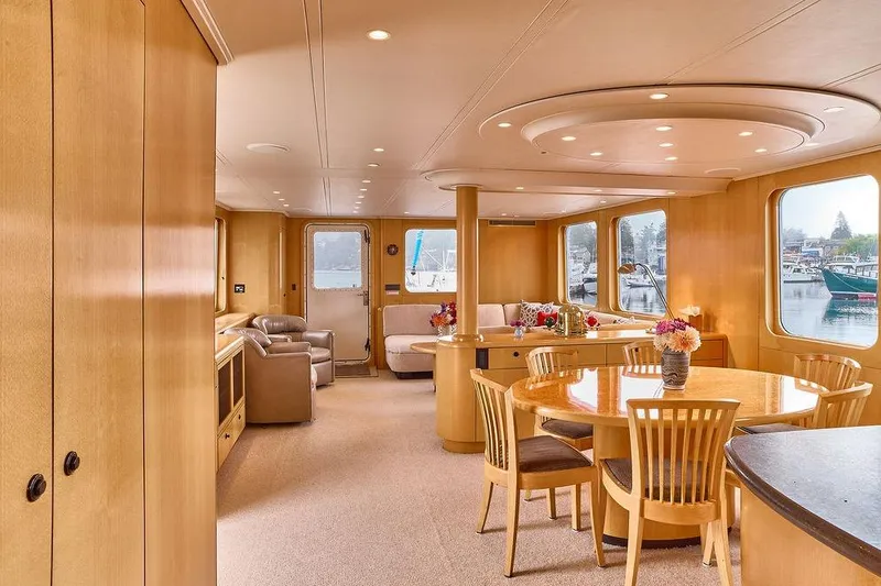 Slide: The Image of Luxurious interior of 2000 Northern Marine 75 yacht with elegant dining area and scenic windows. - 33