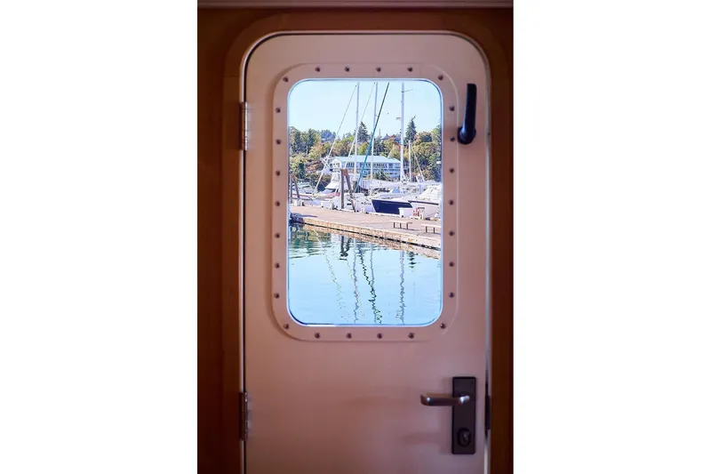 Slide: The Image of View through yacht door of marina with boats and trees, Northern Marine 75, 2000. - 4