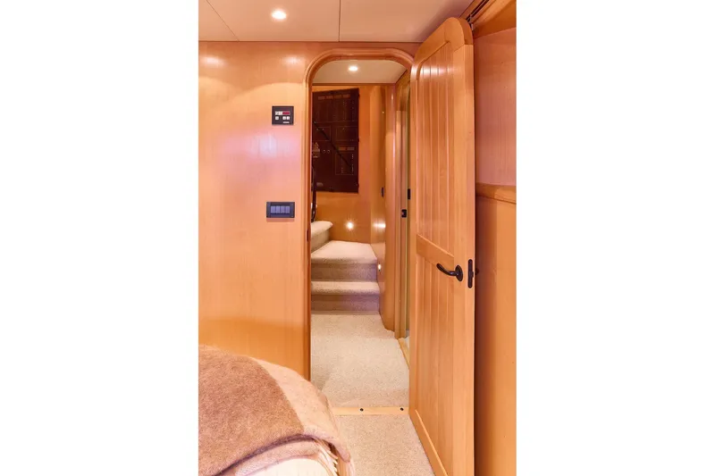 Slide: The Image of Interior hallway of 2000 Northern Marine 75 yacht with wooden doors and soft lighting. - 41