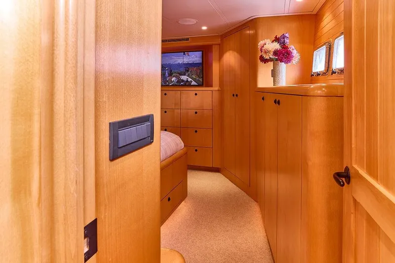 Slide: The Image of Luxurious wooden interior of 2000 Northern Marine 75 yacht cabin with elegant decor. - 43
