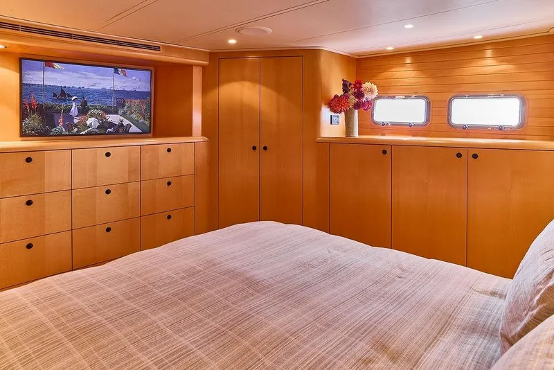 Slide: The Image of Luxurious cabin interior of 2000 Northern Marine 75 yacht with wood finish and artwork. - 46