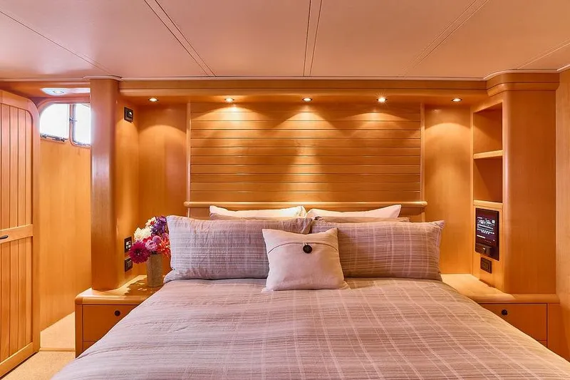 Slide: The Image of Luxurious cabin interior of 2000 Northern Marine 75 yacht with cozy bed and warm lighting. - 47