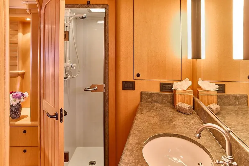Slide: The Image of Luxurious bathroom in 2000 Northern Marine 75 yacht, featuring elegant wood finishes and modern fixtures. - 49