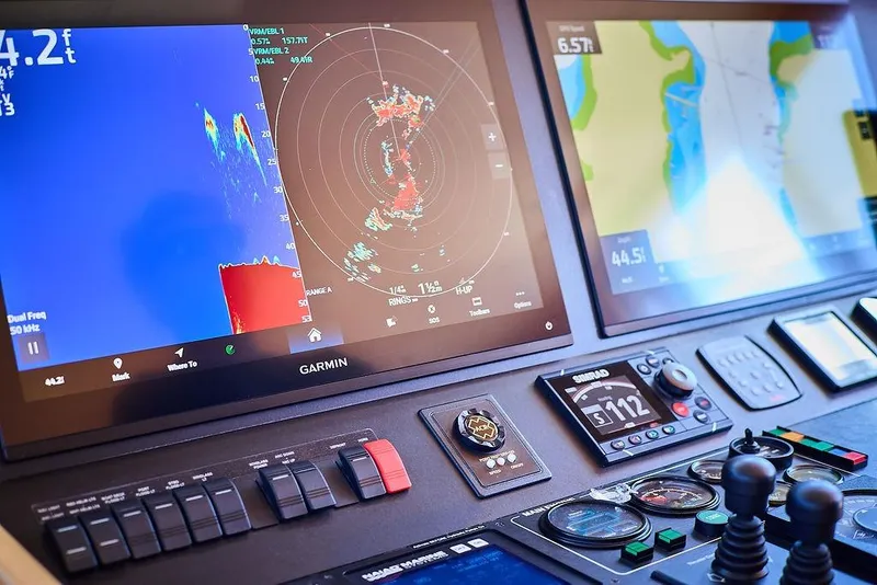 Slide: The Image of Control panel of a 2000 Northern Marine 75 yacht with navigation displays. - 5