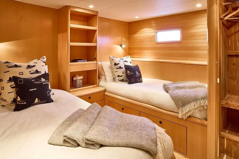 Slide: The Image of Cozy cabin interior of 2000 Northern Marine 75 yacht with twin beds and wooden decor. - 50