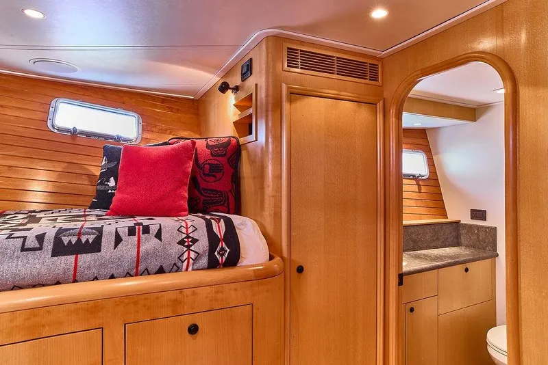 Slide: The Image of Luxurious cabin interior of 2000 Northern Marine 75 yacht with cozy bed and ensuite bathroom. - 51