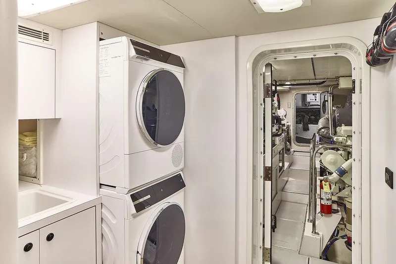 Slide: The Image of Laundry area and engine room on a 2000 Northern Marine 75 yacht. - 54
