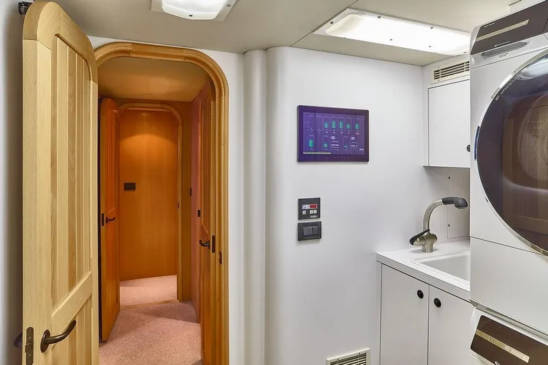 Slide: The Image of Laundry room on 2000 Northern Marine 75 yacht with washer, sink, and control panel. - 55