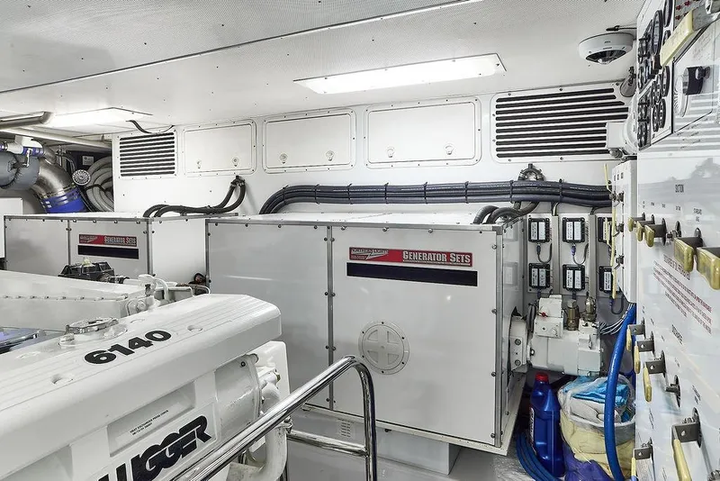 Slide: The Image of Engine room of 2000 Northern Marine 75 yacht with generator and control panels. - 56
