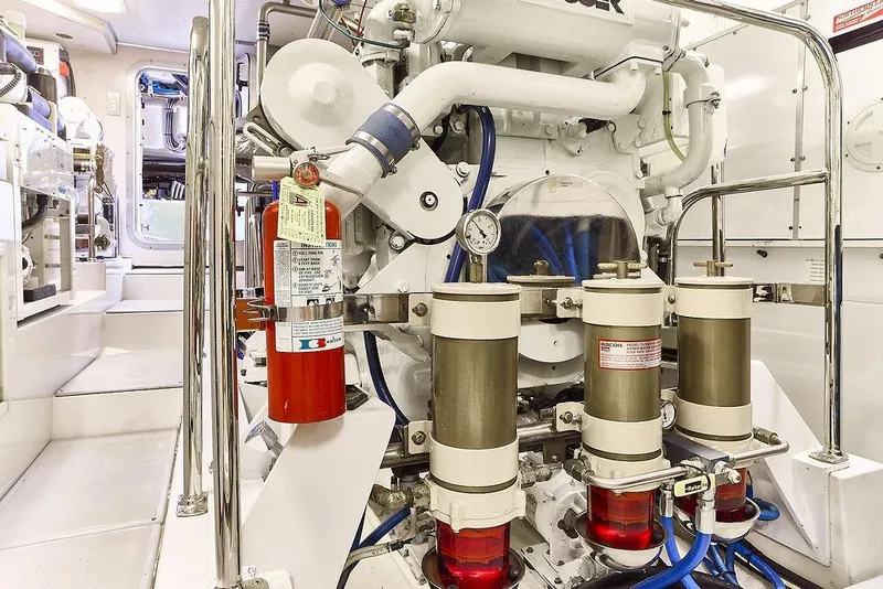 Slide: The Image of Engine room of 2000 Northern Marine 75 yacht with fire extinguisher and filtration system. - 64