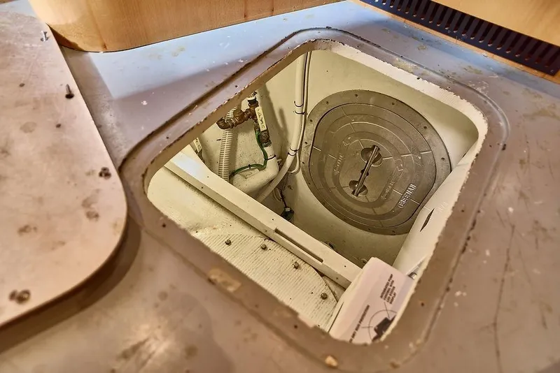 Slide: The Image of Access hatch on a 2000 Northern Marine 75 yacht, revealing mechanical components. - 68