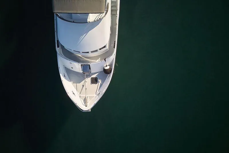 Slide: The Image of Aerial view of 2000 Northern Marine 75 yacht on calm water. - 77