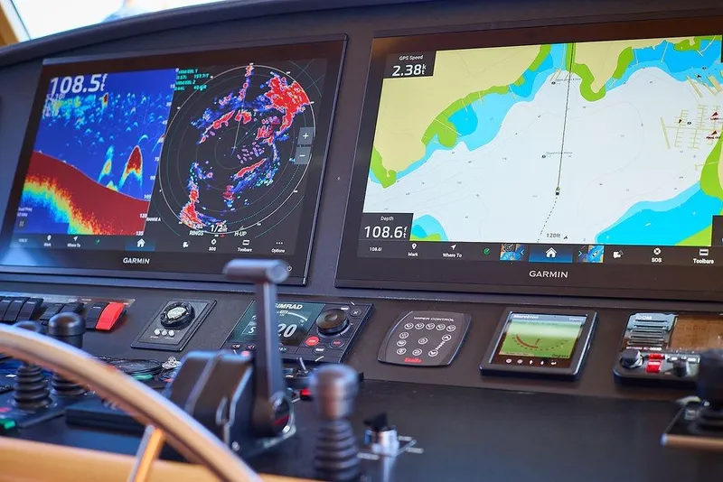 Slide: The Image of Navigation system on Northern Marine 75 yacht, featuring dual Garmin displays, 2000 model. - 9