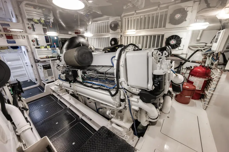Slide: The Image of Engine room of 2012 Viking 70 Enclosed Bridge yacht, featuring advanced machinery and equipment. - 102