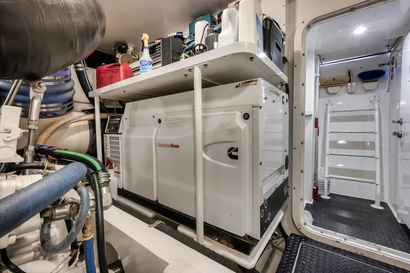 Slide: The Image of Engine room of 2012 Viking 70 Enclosed Bridge yacht with Cummins Onan generator. - 105