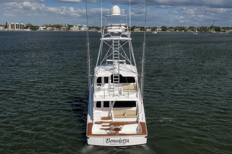 Slide: The Image of 2012 Viking 70 Enclosed Bridge yacht on water, rear view, clear sky. - 12