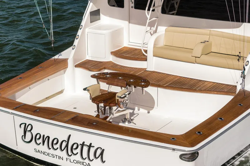 Slide: The Image of Luxury 2012 Viking 70 Enclosed Bridge yacht with elegant teak deck and seating area. - 14