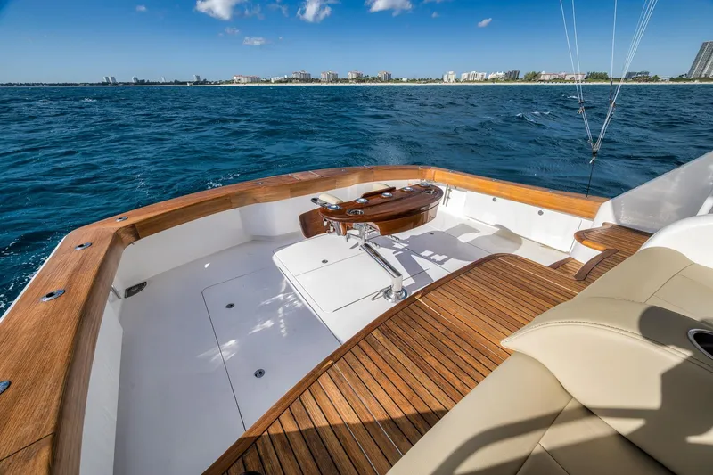 Slide: The Image of Luxurious 2012 Viking 70 Enclosed Bridge yacht deck with ocean view and fishing chair. - 15