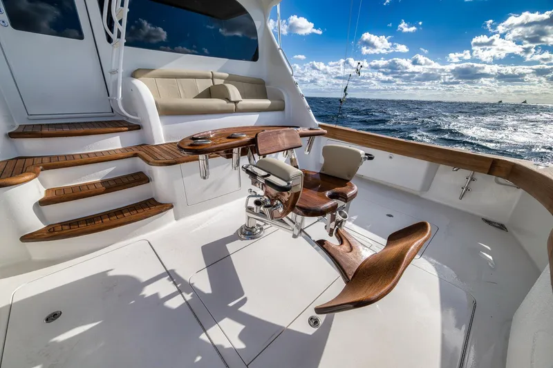 Slide: The Image of Luxurious 2012 Viking 70 Enclosed Bridge yacht deck with fishing chair and ocean view. - 18
