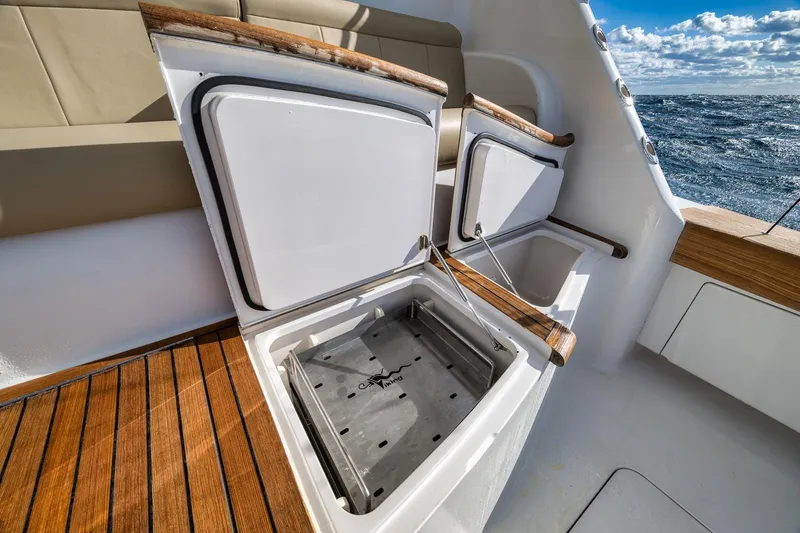 Slide: The Image of Open storage compartments on 2012 Viking 70 Enclosed Bridge yacht with ocean view. - 23