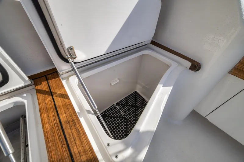Slide: The Image of Storage compartment on 2012 Viking 70 Enclosed Bridge yacht with wooden trim. - 25
