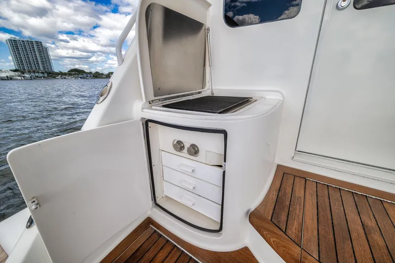 Slide: The Image of Outdoor kitchenette on 2012 Viking 70 Enclosed Bridge yacht with ocean view. - 27