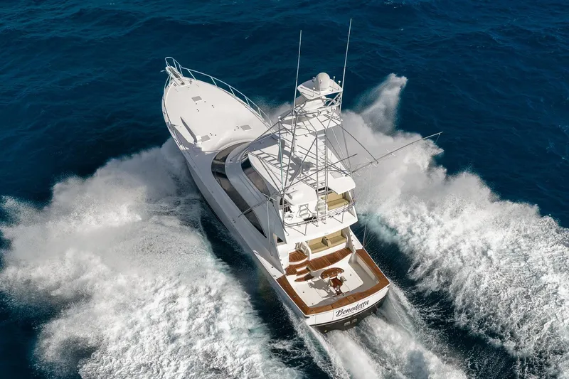 Slide: The Image of Aerial view of 2012 Viking 70 Enclosed Bridge yacht cruising through ocean waves. - 3