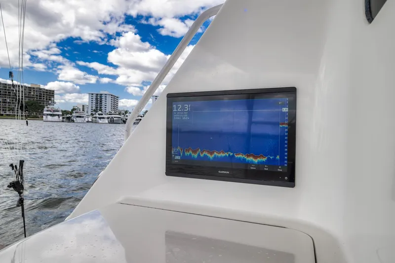 Slide: The Image of Fishfinder display on 2012 Viking 70 Enclosed Bridge yacht, marina background. - 34