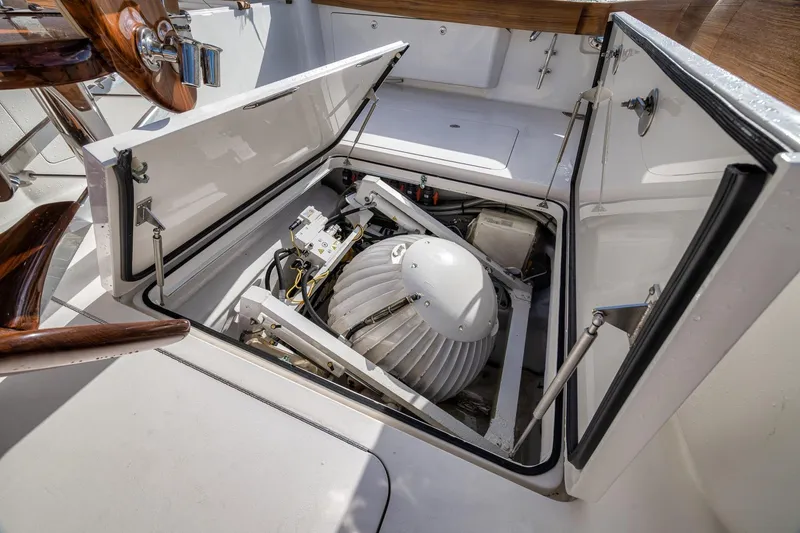 Slide: The Image of Engine compartment of 2012 Viking 70 Enclosed Bridge yacht, showcasing mechanical components. - 36