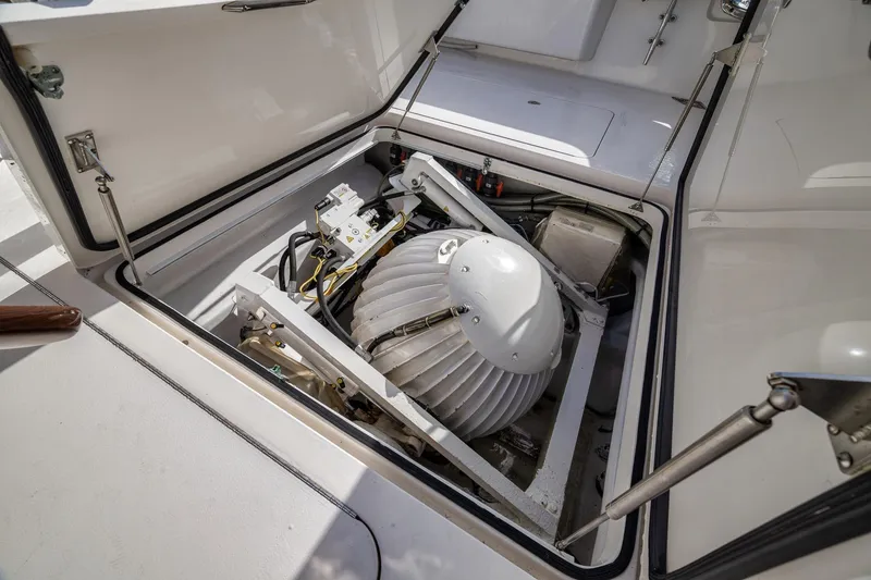 Slide: The Image of Engine compartment of 2012 Viking 70 Enclosed Bridge yacht, showcasing mechanical components. - 37