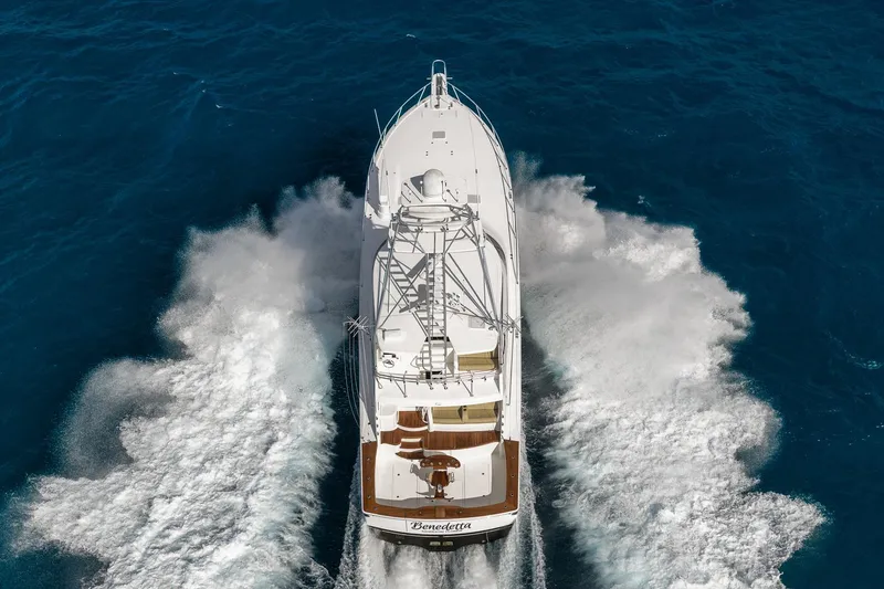 Slide: The Image of Aerial view of 2012 Viking 70 Enclosed Bridge yacht cruising through blue ocean waters. - 4