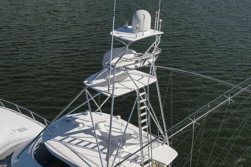 Slide: The Image of 2012 Viking 70 Enclosed Bridge yacht with tower on open water. - 40