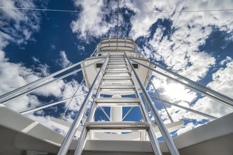 Slide: The Image of Ladder view on 2012 Viking 70 Enclosed Bridge yacht against cloudy sky. - 41